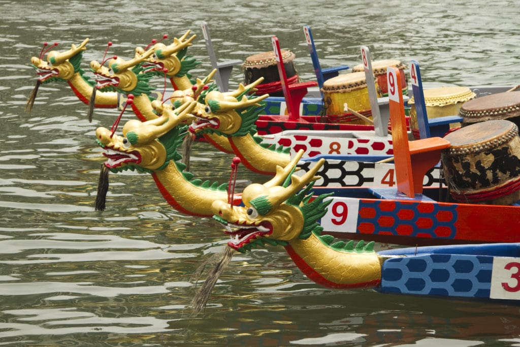 Six dragon boats with different numbers.