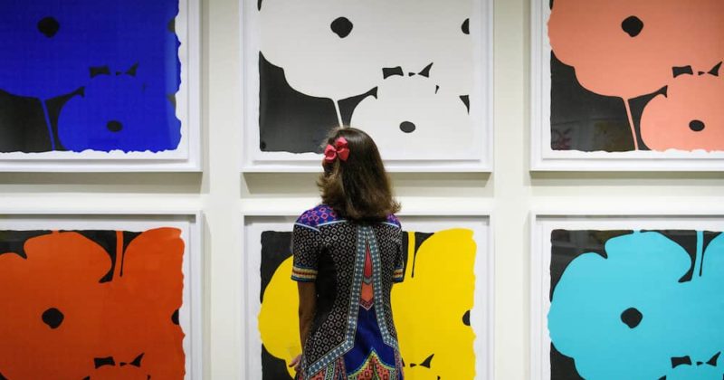 Young girl looking at an art gallery