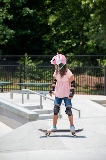 Girl riding her skateboard in the park