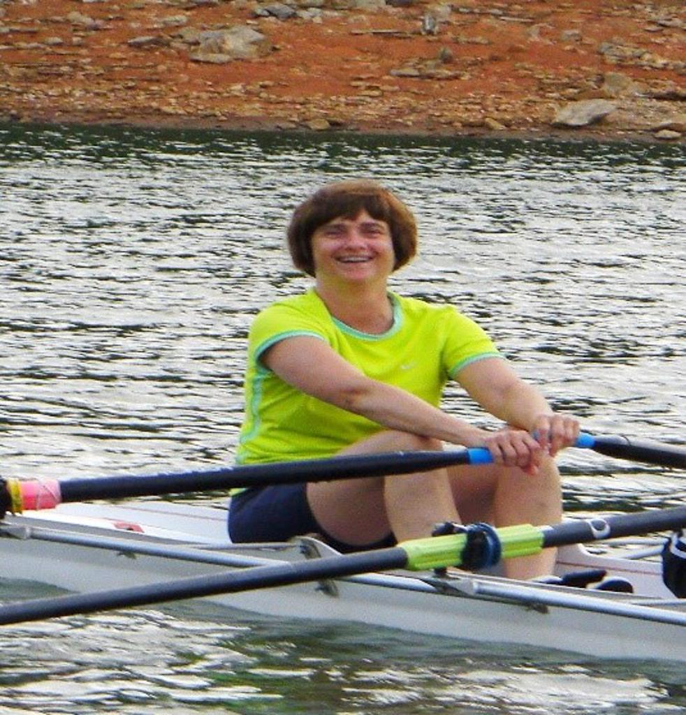 Hynes smiling for a picture while rowing