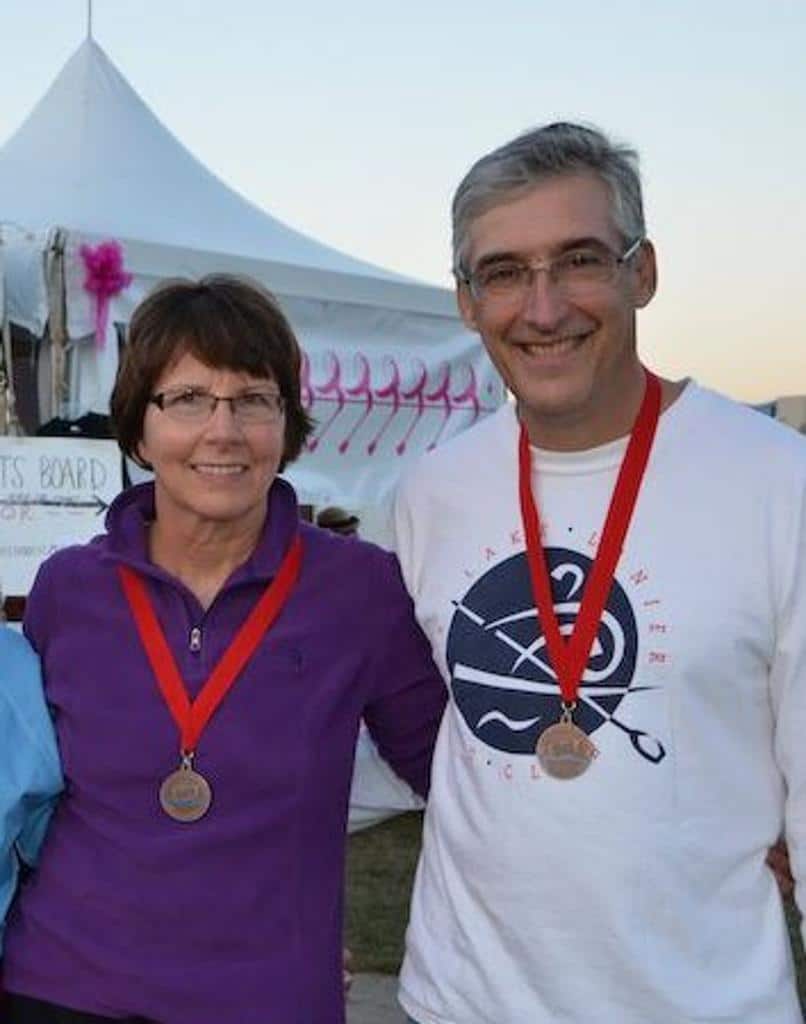 People posing with their medals for LLRC