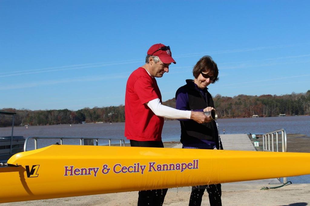 Henry and Cecily Kannapell pouring water on their rowing boat