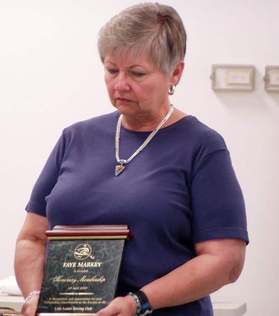 Mrs. Markey holding an award