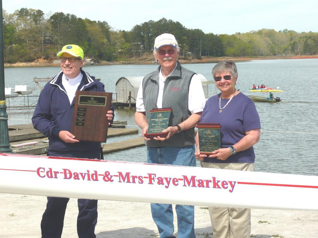 The Markey's posing for a photo with their awards