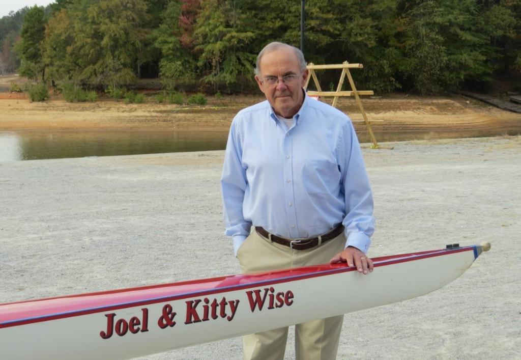 Mr. Wise posing with his rowing equipment