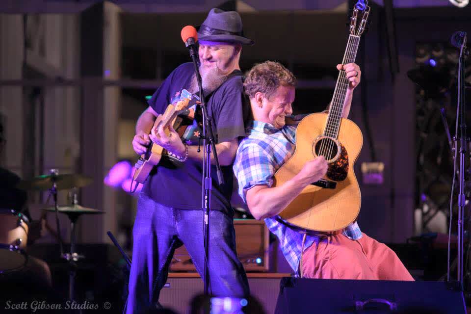 Musicians performing at a concert on stage