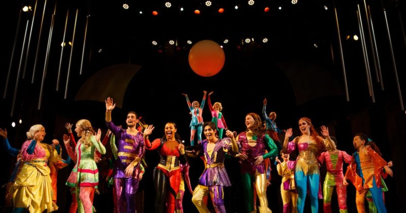 Theater group waving to the crowd after a performance