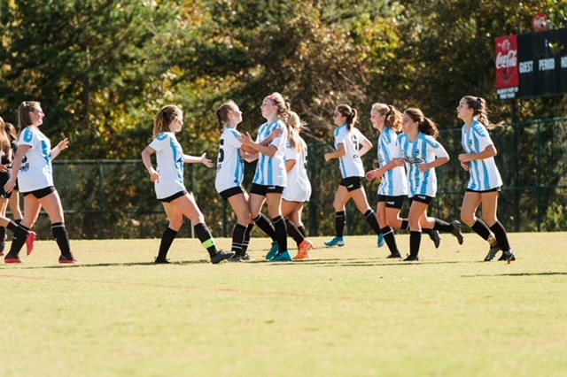 Girls soccer team playing a game